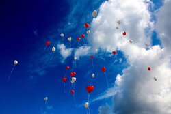 Red and White Balloon in Sky