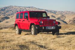 Red Jeep Wrangler SUV on Outdoors