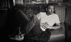 Ryan Reynolds Lying On Sofa Black And White Wallpaper