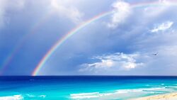 Sky Rainbow On Sea