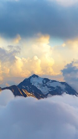 Snowy Mountain above Cloud Sky View Photo