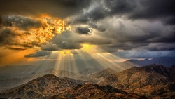Sun Rays on Mountain from Clouds